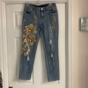 A pair of ankle length jeans.